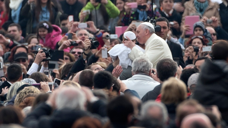 Francis kisses mini-me pope in Rome
