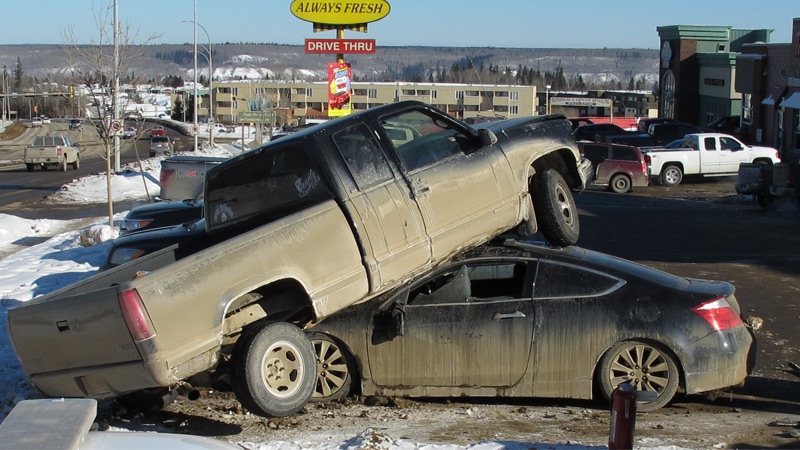 RCMP are investigating a collision in the Thickwood area of Fort McMurray, where a truck was found on top of a car Tuesday, February 25. Supplied.