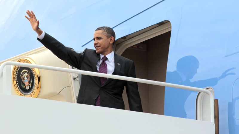 U.S. President Barack Obama waves before boarding Air Force One