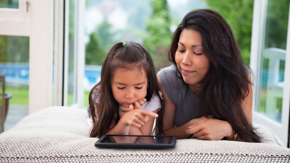 Adult and child using a tablet computer