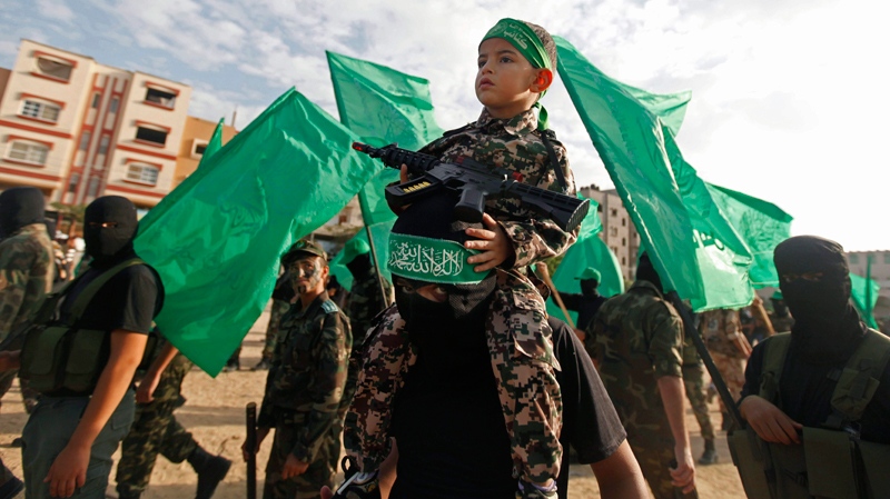 Hamas militia march in Nuseirat Refugee Camp