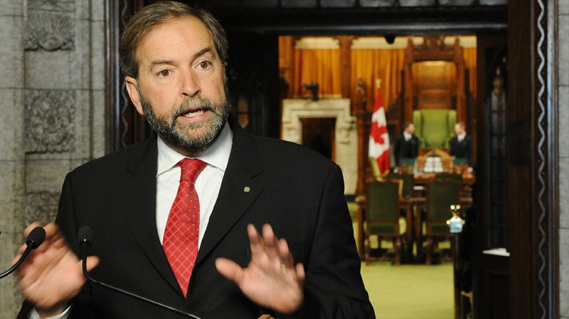 NDP MP Thomas Mulcair speaks to reporters in the foyer of the House of Commons on Sept. 27, 2011
