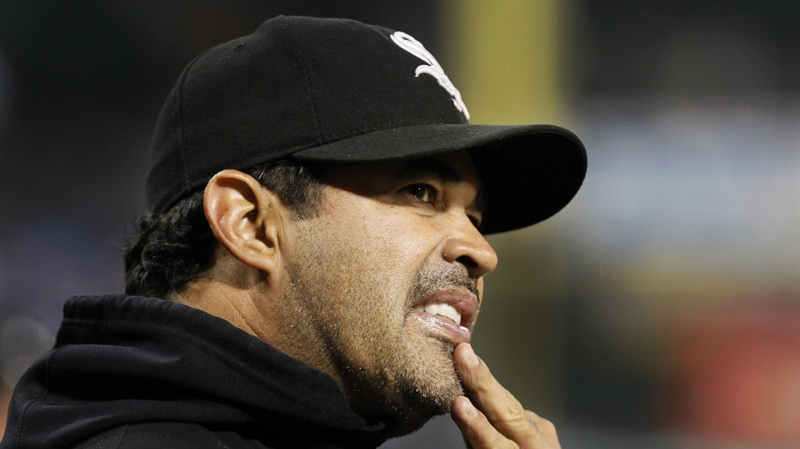 Chicago White Sox manager Ozzie Guillen looks into the stands during a baseball game against the Toronto Blue Jays, Monday, Sept. 26, 2011, in Chicago. Guillen met with owner Jerry Reinsdorf on Monday to discuss his future with the team. No decision was made on whether he will return in 2012. Guillen said he met with Reinsdorf for about 30 minutes. The manager said he made it clear that he would like to come back, but only for a contract extension for more money. 