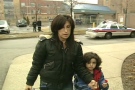 The mother and her son walk into the 31 Division police station in Toronto following the incident.