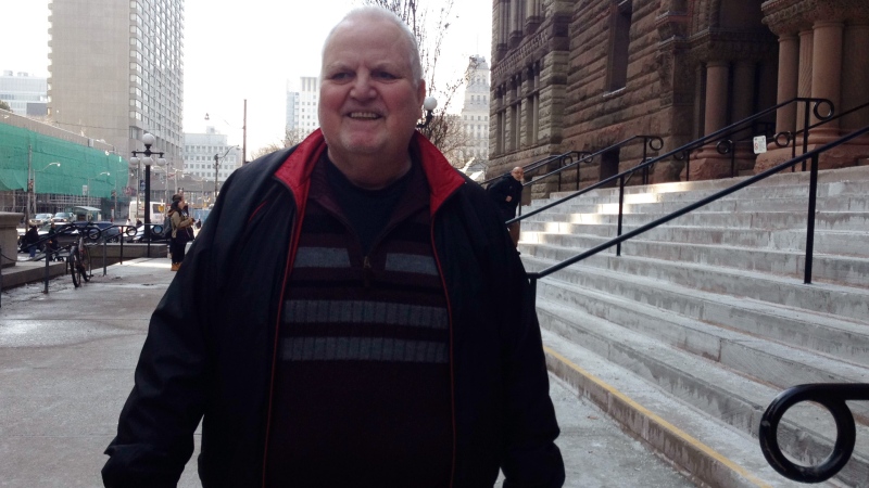 James Brunton walks out of the Old City Hall courthouse in Toronto on Tuesday, March 11, 2014. 