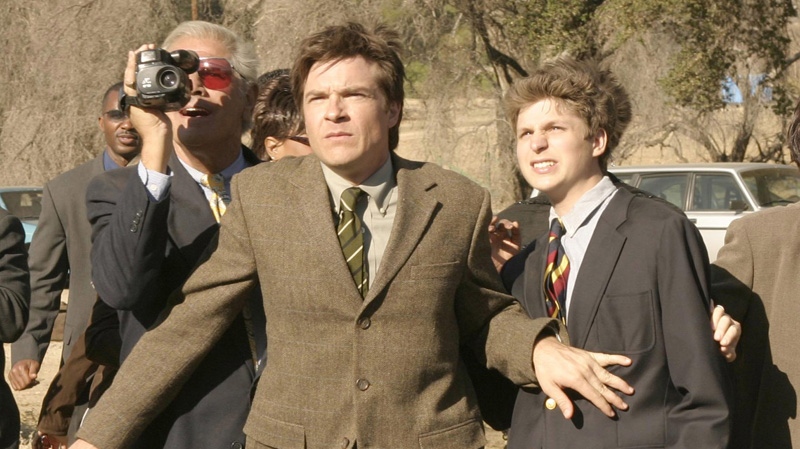 In this undated publicity photo originally released by Fox, Jason Bateman, centre, and Michael Cera, right, are shown in a scene from the TV series "Arrested Development." (AP Photo/Fox, Sam Urdank, File)