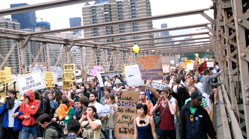 Protesters walk onto New York's Brooklyn Bridge before police began making arrests during a march by Occupy Wall Street, Saturday, Oct. 1, 2011. (AP / Stephanie Keith)