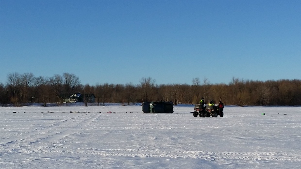 Crews respond to a car on the ice on the east side of Lake Simcoe Sunday afternoon. (Steve Trebelco / CTV News)