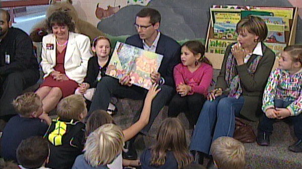 Liberal Leader Dalton McGuinty reads to students during a campaign stop in Cambridge, Ont. on Tuesday, Oct. 4, 2011.