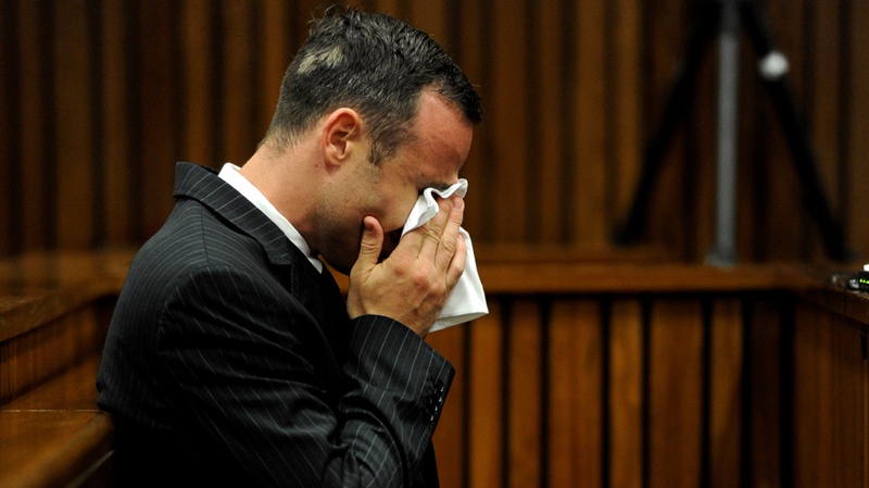 Oscar Pistorius sits in the dock in Pretoria court