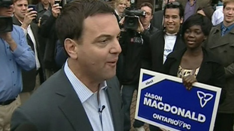 Progressive Conservative Leader Tim Hudak talks to people at a campaign stop on Tuesday, Oct. 4, 2011.