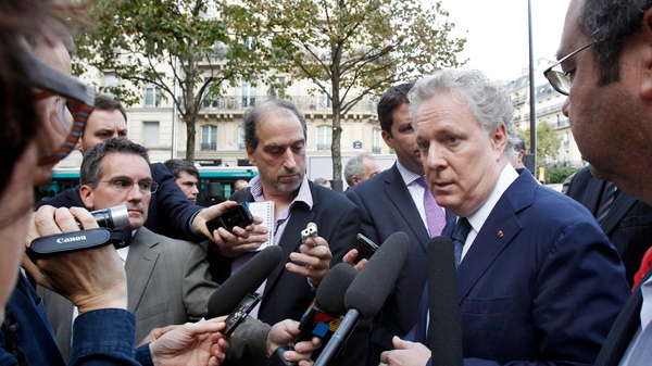 Premier Jean Charest talks to reporters at the Place du Quebec in Paris, Tuesday Oct. 4, 2011.(AP Photo/Remy de la Mauviniere)