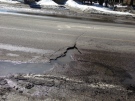 A large pothole is seen in London, Ont. on Tuesday, March 18, 2014. (Nick Paparella / CTV London)