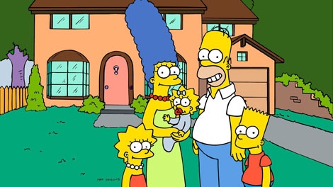 'The Simpsons' family pose in front of their home, from left, Lisa, Marge, Maggie, Homer and Bart Simpson. 