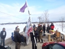 Protestors are seen at a blockade on a Via Rail line and Wymans Road west of Napanee, Ont. to raise awareness about missing and murdered aboriginal women, Wednesday, March 19, 2014. 