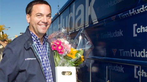 Ontario Conservative Leader Tim Hudak gets back on his campaign bus after buying flowers for his wife on their wedding anniversary in Oakville, Ont., on Wednesday Oct. 5, 2011. (Frank Gunn / THE CANADIAN PRESS)