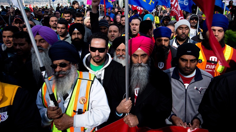 Striking container truck drivers attend a rally in Vancouver, on Friday March 21, 2014. (THE CANADIAN PRESS/Darryl Dyck)