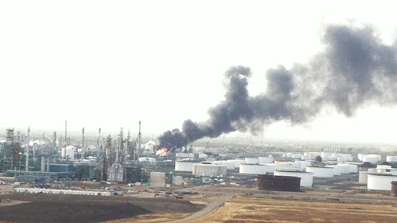  Flames and smoke is seen after an explosion at the Co-op crude oil refinery in Regina on Thursday, Oct. 6, 2011. (Shaun Reich / MyNews.CTV.ca)