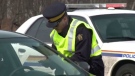 RCMP officers conduct a roadside check for impaired drivers in Nova Scotia.