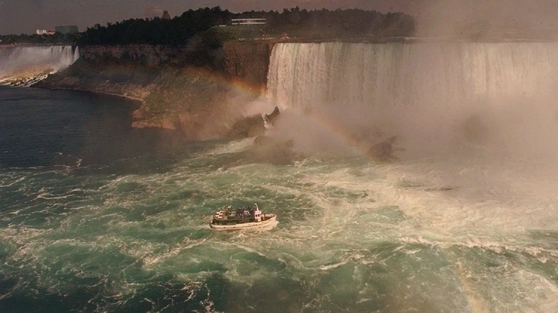 A Maid of the Mist tourboat takes sightseers to the base of Horseshoe Falls, right, after sailing up the Niagara River past the American Falls, left, in this Aug. 28, 1997 photo at Niagara Falls, N.Y. 
