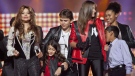 From left, Latoya Jackson, Blanket Jackson, Prince Jackson, Paris Jackson and others join together on stage for the finale of the Michael Forever the Tribute Concert, at the Millennium Stadium in Cardiff, Wales, Saturday, Oct. 8, 2011. 