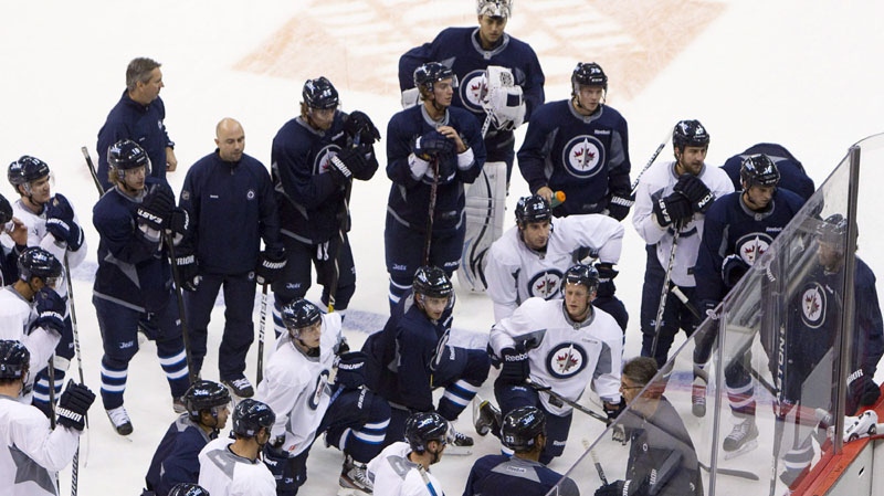 Members of the Winnipeg Jets take part in a team practice in Winnipeg, Saturday, Oct. 8, 2011. The Jets will play the Montreal Canadiens in their inaugural game on Sunday. 