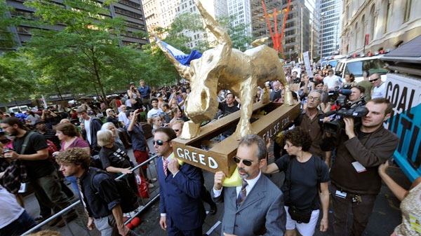 A coalition of clergy carried a "False Idol" to the Occupy Wall Street encampment in Zuccotti Park in New York, Sunday, Oct. 9, 2011. (AP / Henny Ray Abrams)