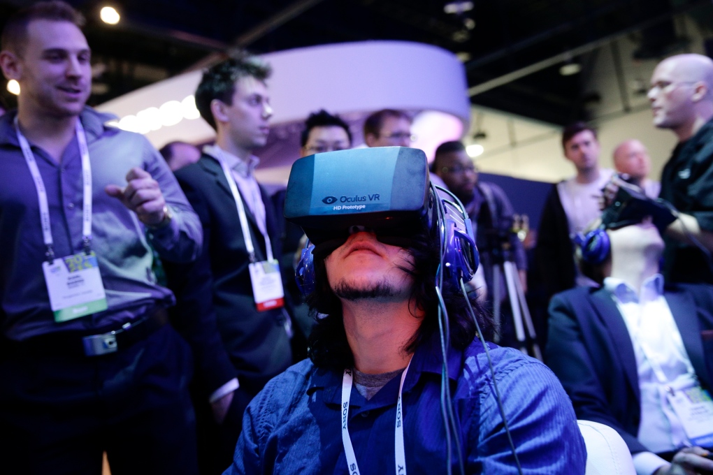 Man plays video game wearing Oculus Rift 