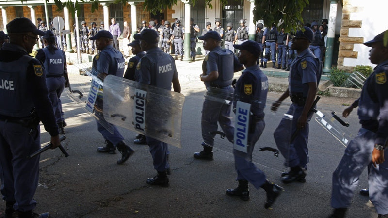 Police provide security outside the court in Ventersdorp, South Africa, Wednesday, April 14, 2010 as suspects in the murder of slain white supremacist leader Eugene Terreblanche appear in court for bail hearings.