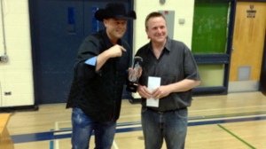 Country star Gord Bamford (left) presents Winnipeg teacher Jeff Kula with the MusiCounts Teacher of the Year award on March 26, 2014.