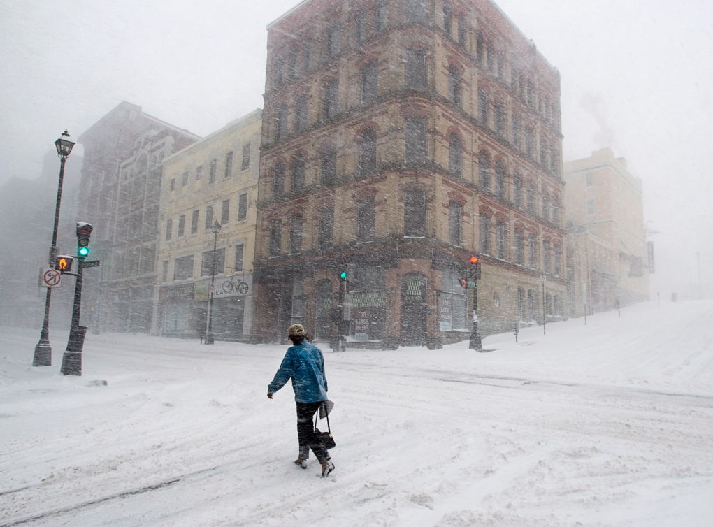 Pedestrian walks through Halifax storm 