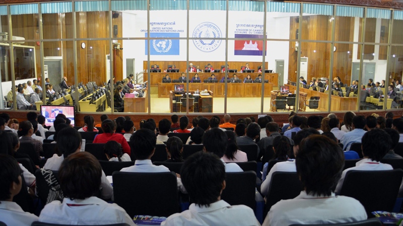 In this Aug. 29 2011 file photo, people in the visitors' gallery watch the court room of the UN-backed war crimes tribunal for a hearing of former Khmer Rouge top leaders. (AP Photo/Extraordinary Chambers in the Courts of Cambodia, Mark Peters)