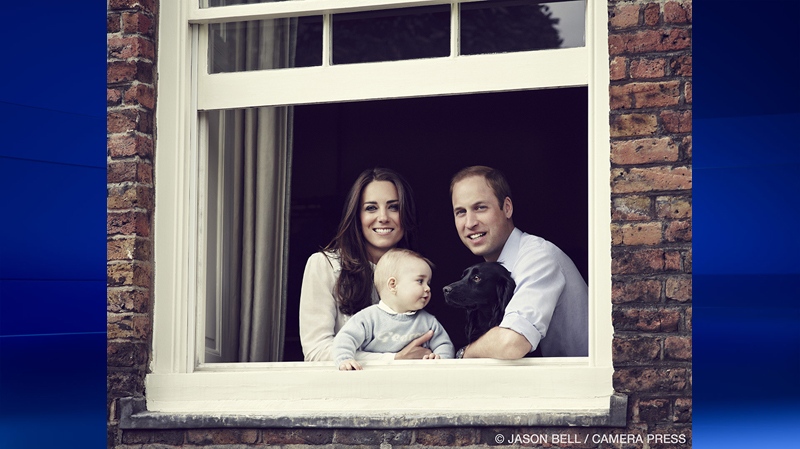 Prince George of Cambridge with his parents