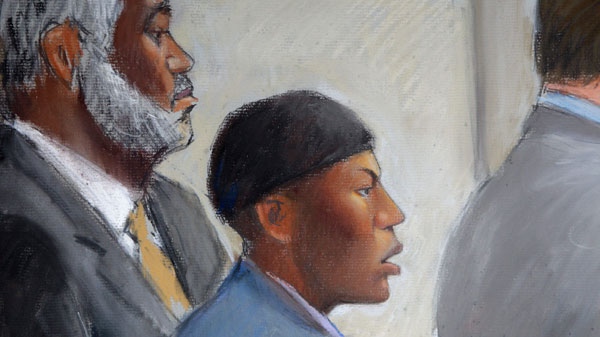 In this courtroom drawing, Umar Farouk Abdulmutallab, center, appears in U.S. District Judge Nancy Edmunds' courtroom in Detroit with Anthony Chambers, his lawyer who was assisting in his defense, left, and Assistant U.S. Attorney Jonathan Tukel, right, Wednesday, Oct. 12, 2011. (AP / Jerry Lemenu)