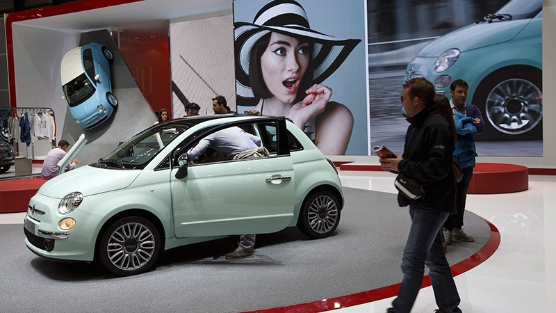 Visitors gather at the Fiat booth