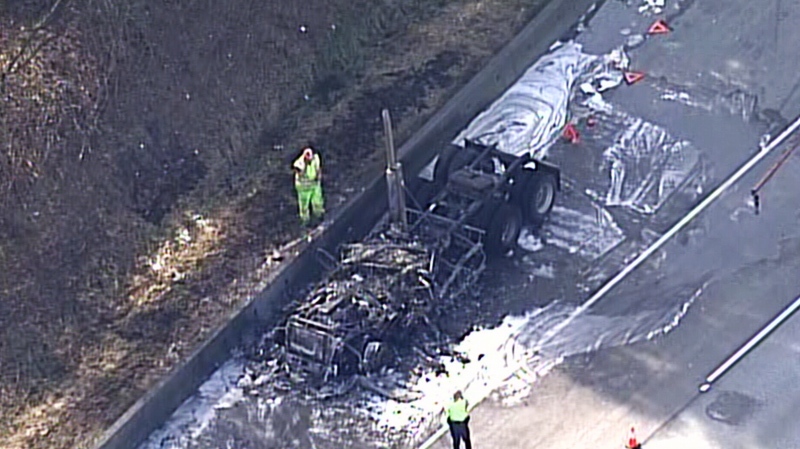 Firefighters and Mounties respond to a fire that left a semi truck almost obliterated on Highway 1 in Langley Monday afternoon. March 31, 2014. (CTV/Chopper 9)