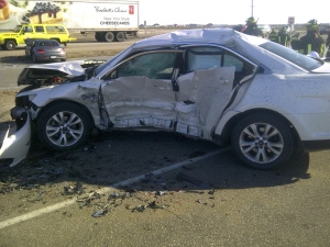 A car involved in a collision on the Trans-Canada Highway near Emerald Park is seen in this photo taken Tuesday. (RCMP handout)