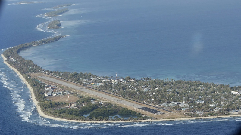  this Oct. 13, 2011 photo, Funafuti, the main island of the nation state of Tuvalu, is seen from a Royal New Zealand airforce C130 aircraft as it approaches at Funafuti, Tuvalu, South Pacific. (AP Photo/Alastair Grant)