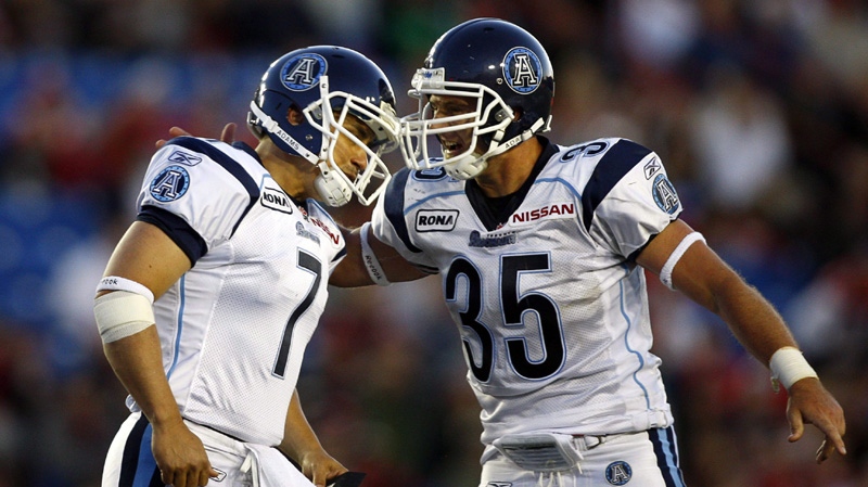 oronto Argonauts' Noel Prefontaine, left, celebrates his game winning kick with teammate Kevin Eiben during second half CFL football action against the Calgary Stampeders in Calgary, Alta., Friday, July 1, 2011. 