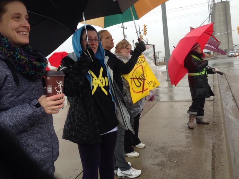 Toyota workers opposed to unionization march outside the plant in Woodstock, Ont. on Friday, April 4, 2014. (Cara Campbell / CTV London)