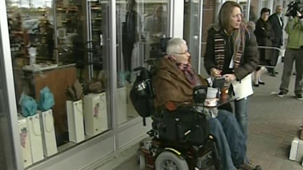 Helene Leduc returns to the SAQ store where she was shot and paralyzed one year ago (Oct. 18, 2011)