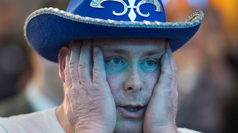 Parti Quebecois supporter watches election results