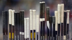 Hockey sticks are seen in this file photo. (AP Photo/Mark Humphrey)