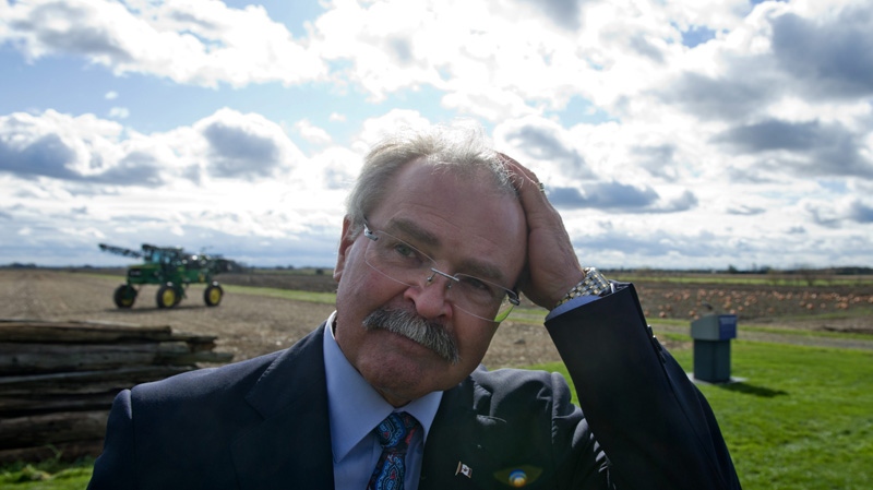 Agriculture Minister Gerry Ritz leaves an announcement regarding the introduction of a bill to eliminate the Canadian Wheat Board during a press conference at a farm in Ottawa on Tuesday, Oct. 18, 2011. (Sean Kilpatrick / THE CANADIAN PRESS)