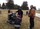 Rodney Stafford, right, was among those visiting the grave of his daughter Victoria Stafford on the five-year-anniversary of her disappearance in Woodstock, Ont. on Tuesday, April 8, 2014. (Nick Paparella / CTV London)