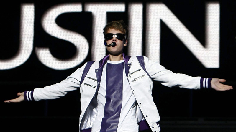 Pop sensation Justin Bieber performs during his "My World Tour" concert at Foro Sol in Mexico City, Saturday Oct. 1, 2011. (AP Photo/Marco Ugarte)