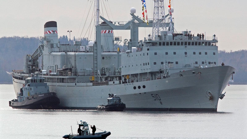 HMCS Preserver, one of Canada's operational support ships, designed to carry large amounts of fuel, provisions, and dry stores during naval operations, is pushed by tugs in Halifax harbour on Wednesday, Oct. 19, 2011.  (Andrew Vaughan / THE CANADIAN PRESS)