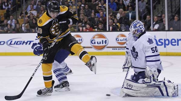 Boston Bruins center Tyler Seguin, front left, tries to tip the puck past Toronto Maple Leafs goalie Jonas Gustavsson (50) in the second period of an NHL hockey game in Boston, Thursday, Oct. 20, 2011. 