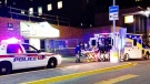 An ambulance arrives at a trauma centre in Toronto after transporting a person who was shot in a police-involved shooting in Aurora Saturday, April 12, 2014. (Tom podolec/CP24)