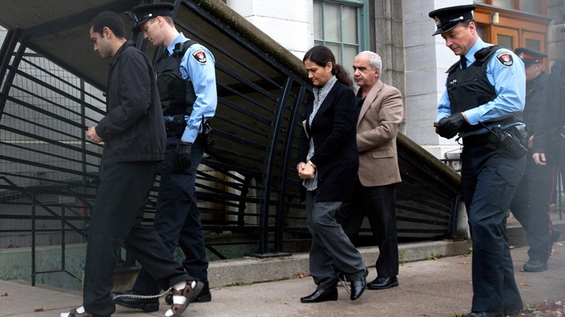 Hamed Shafia, (left to right) Tooba Mohammad Yahya and Mohammad Shafia arrive at the Frontenac Court courthouse in Kingston, Ont. on Friday, Oct. 21, 2011. (Lars Hagberg / THE CANADIAN PRESS)